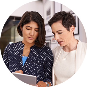 two women talking to each other.