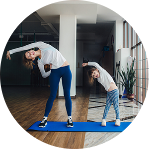 mother and daughter doing yoga